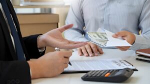 Business transaction involving money and contract for warehouse property loan