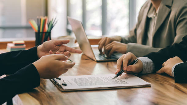 Financial advisor discussing proof of funds letters with clients
