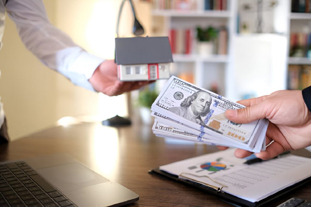 Handing money for a real estate deal, representing fix and flip loans