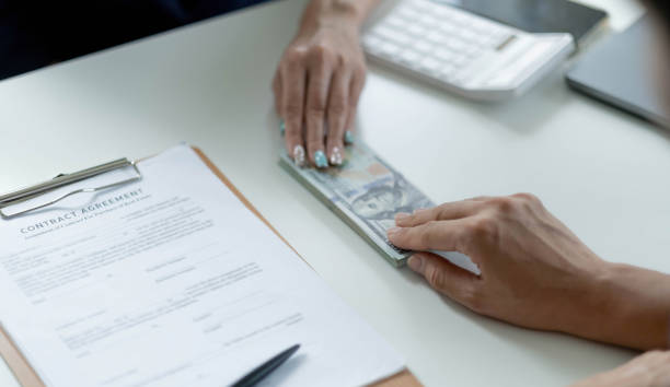 Home renovation loan payment being made with signed agreement