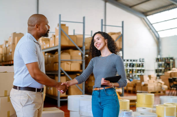 Successful warehouse property loan agreement shown through handshake