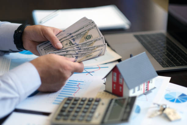 Investor counting cash for residential hard money loan financing