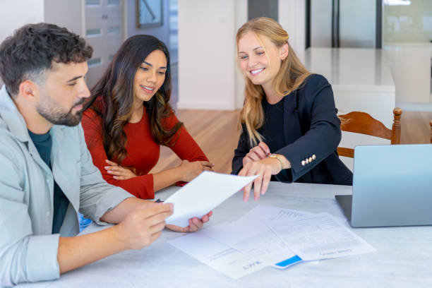Couple consulting with advisor about multi-family property loan options