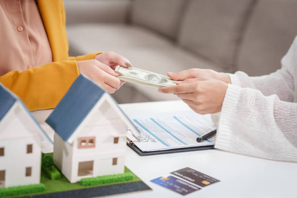 Exchanging cash during residential hard money loan agreement signing