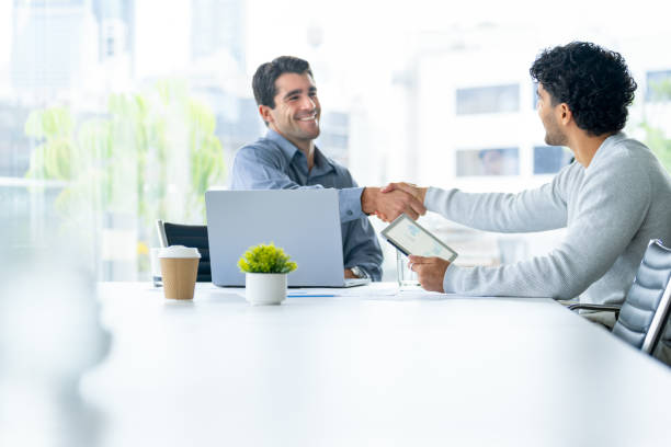 Final handshake after completing a retail property loan agreement