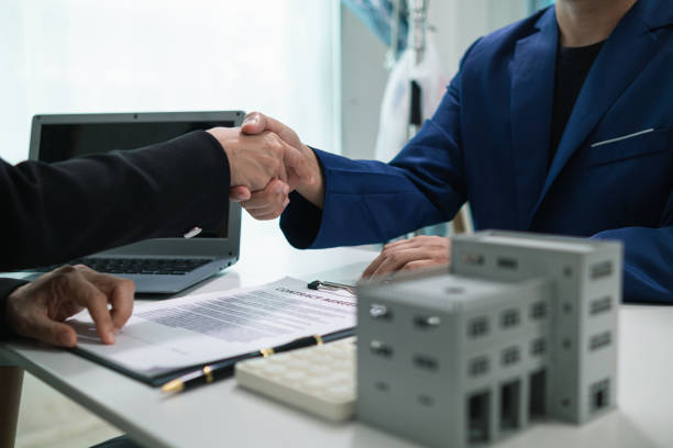 Handshake between lender and borrower symbolizing mixed-use property loan