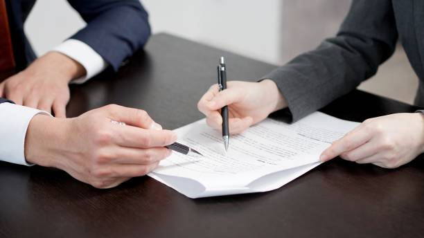 Reviewing paperwork for a No Income Verification Loan approval