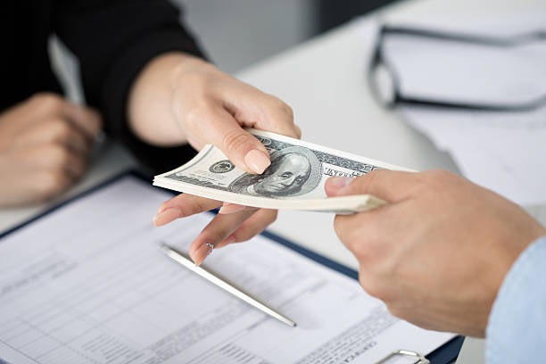 Handing over cash during a residential private money loan transaction