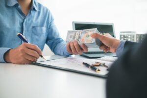 Client receiving loan funds from best commercial hard money lenders