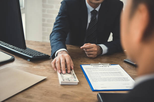 Industrial real estate lenders exchanging cash to finalize a deal