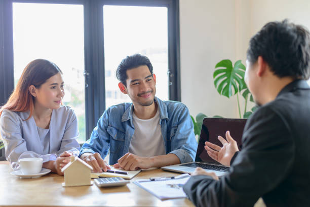 Clients discussing options with mixed-use property loan specialists