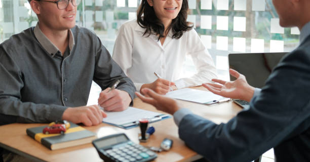 Loan lender and borrowers discussing foreclosure bailout loan