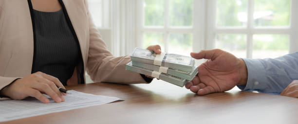 Rehab hard money lender completing transaction with cash transfer
