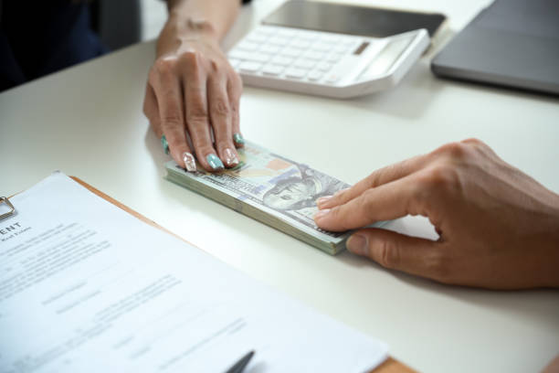 Money exchange between retail property loan lenders in the office