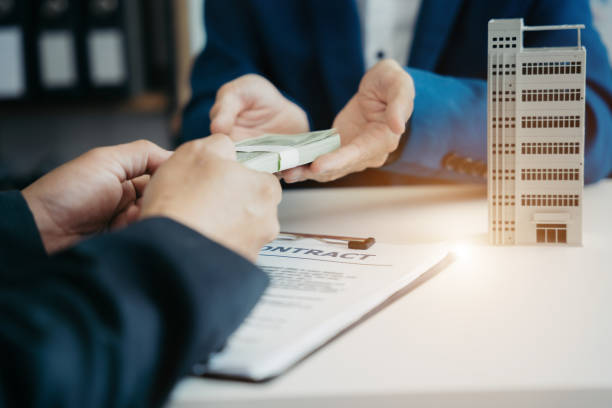 Money exchange during industrial property loan deal finalization