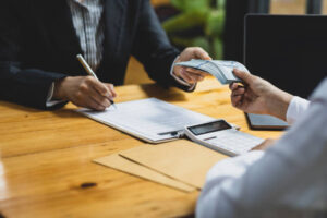 Loan agreement signing and handing over cash for property flip