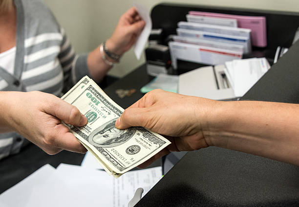 Commercial hard money lender providing funds to a customer in the office