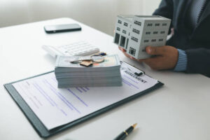 Property loan lender discussing financial agreement with clients