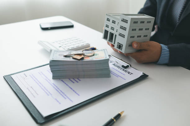 Property loan lender discussing financial agreement with clients