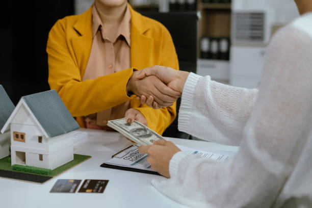 Client completing payment process after approval from land loan lender
