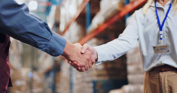 Handshake between lender and borrower after warehouse loan agreement