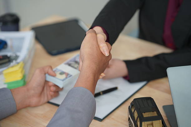 Industrial real estate lenders shaking hands after a financial deal