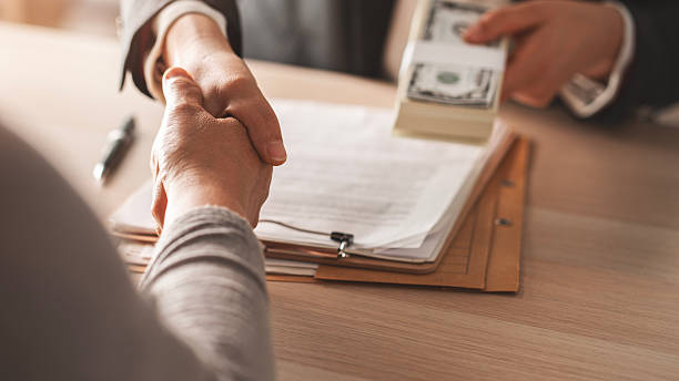 Successful business deal sealed with loan for office space funding