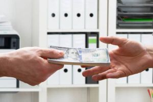 Person receiving cash as part of approved loan for office space