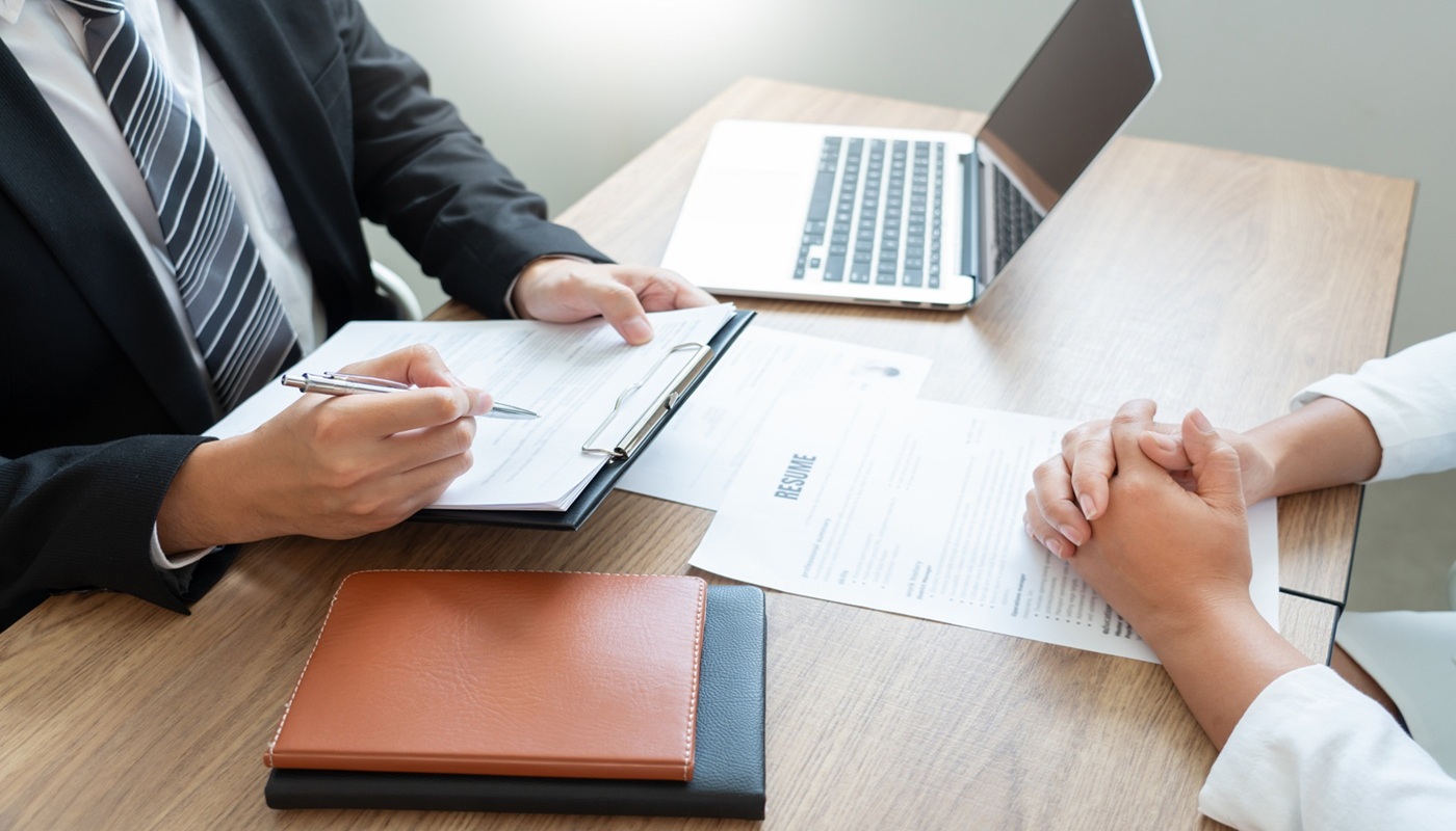Private money lender reviewing residential loan documents with borrower