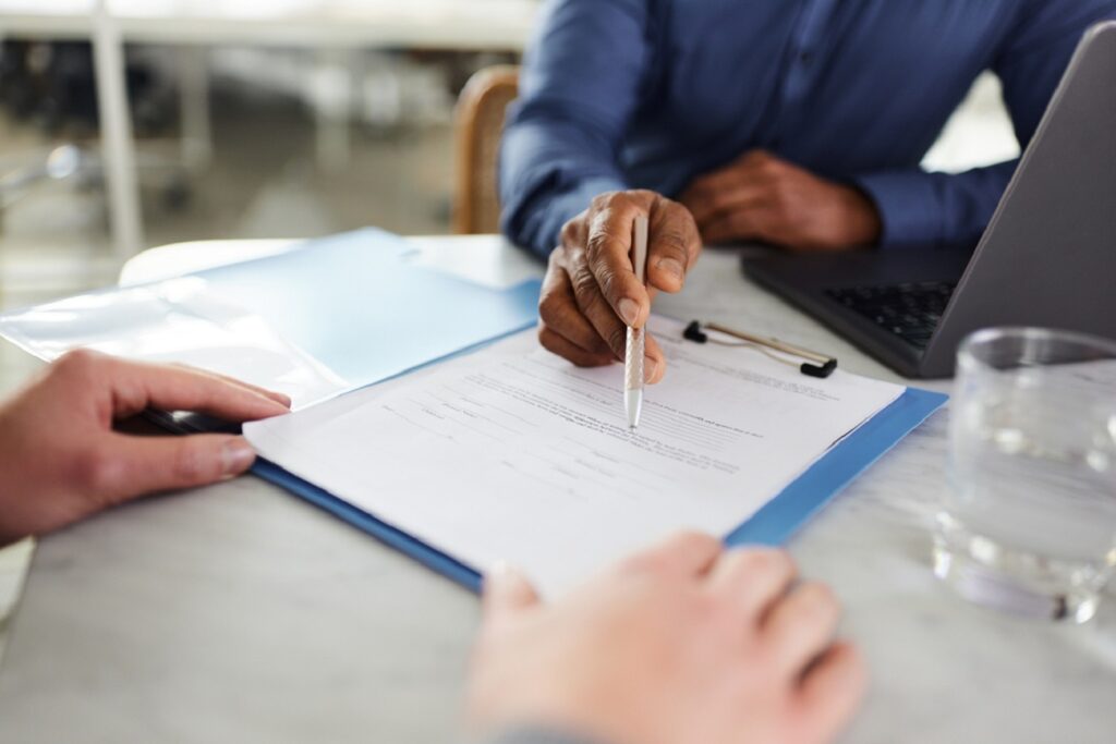 Real estate agent discussing proof of funds letter with a client