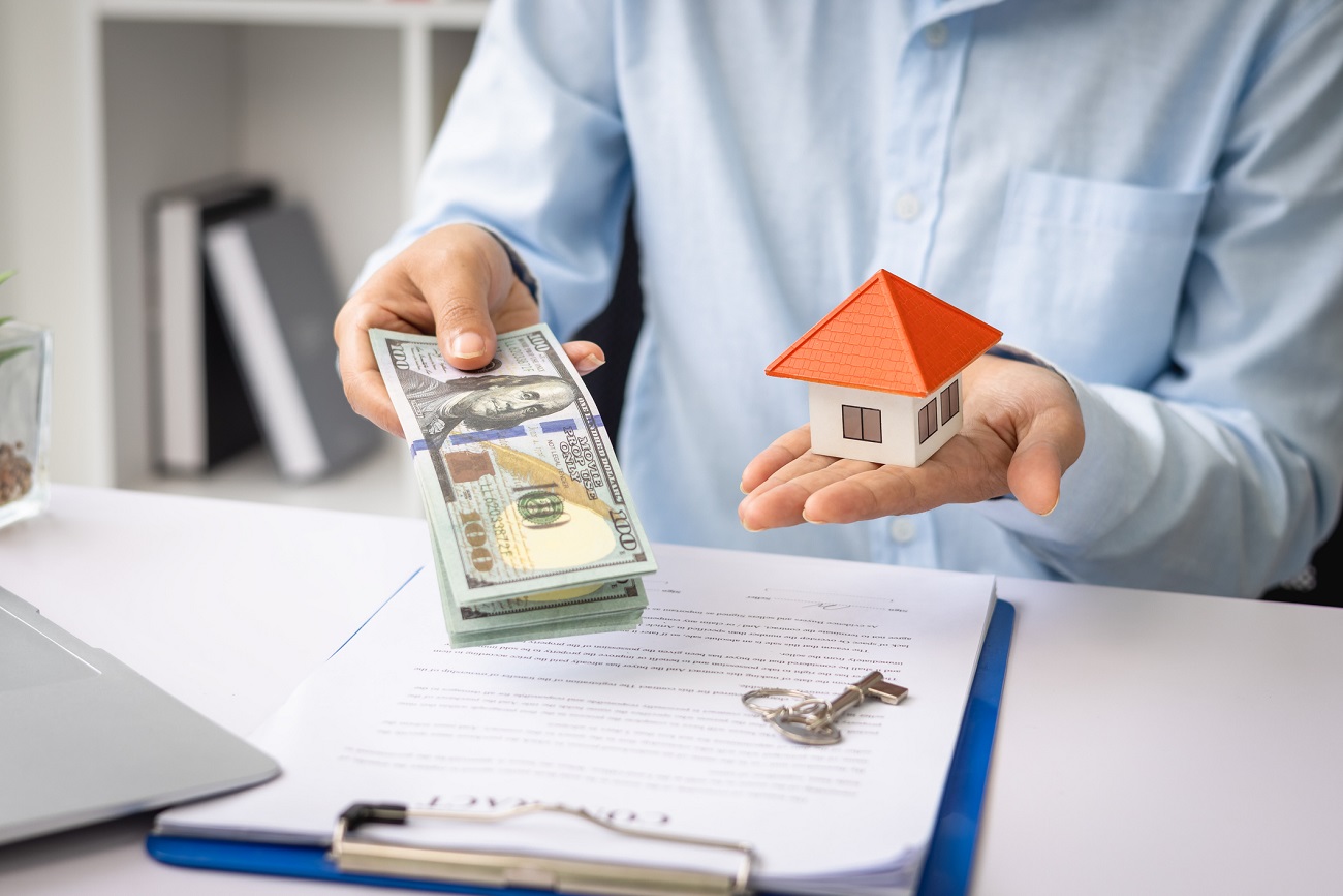 Cash exchange during land loan funded property purchase
