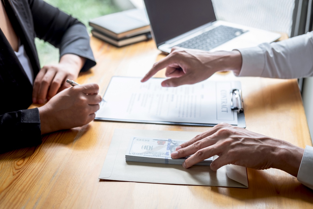 Business hard money loan approval with signed agreement and cash