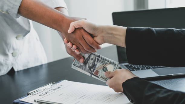 Signing commercial private money loan agreement with cash exchange