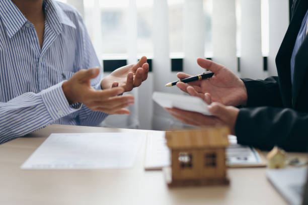 Lenders analyzing bridge loan approval paperwork and terms
