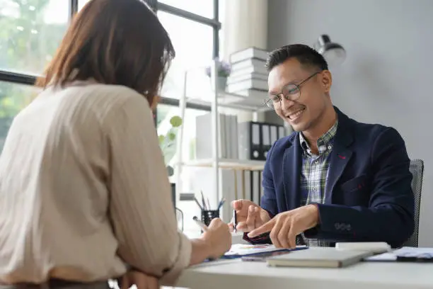 Private lender reviewing hard money loan terms with investor