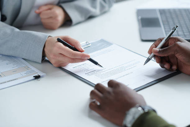 Client reviewing loan application with finance advisor
