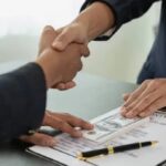 Private lender and borrower finalizing loan deal