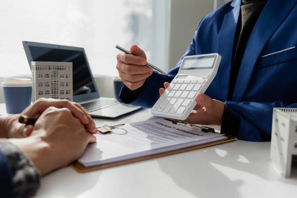 Private money loan consultation with lender reviewing financing terms
