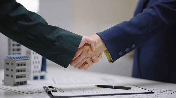 Handshake after finalizing a commercial private money loan agreement