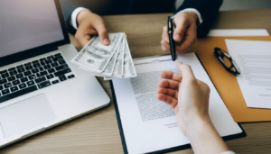 Handing over cash for stated income loan agreement signing